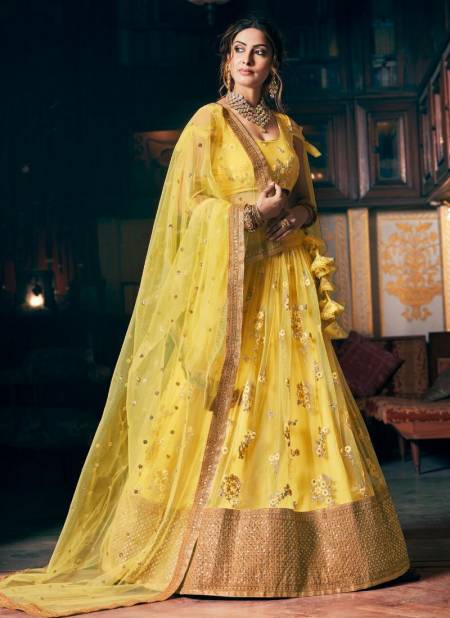 Yellow Colour TEJASVEE AAKRUT Bridal Wedding Wear Heavy Net Embroidery Sequence And Dori Work Bridal Lehenga Choli Collection 1002